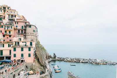 Panoramic view of beach and buildings against sky