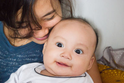 Portrait of mother with baby