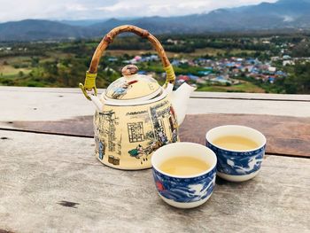 Close-up of tea served on wooden table