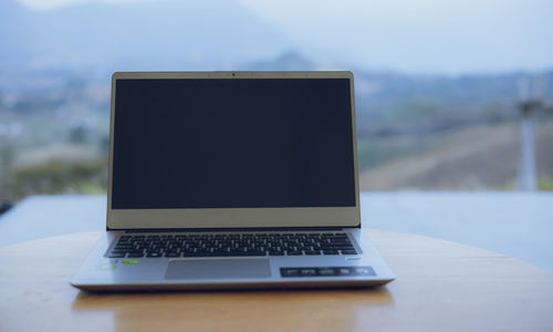 Computers placed on a desk for working on the go