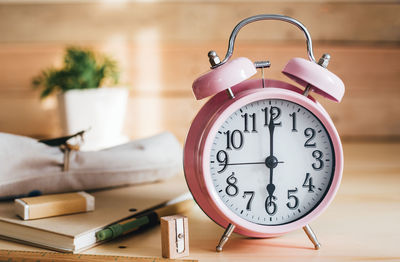 Close-up of clock on table