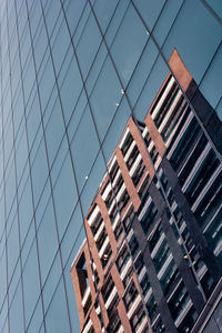 Low angle view of modern buildings against sky