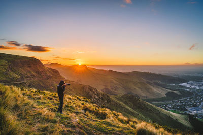 Scenic view of mountains against sky during sunset