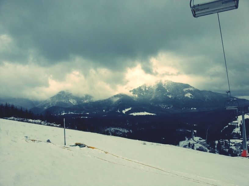 mountain, snow, sky, winter, mountain range, cold temperature, cloud - sky, weather, cloudy, season, scenics, landscape, tranquil scene, cloud, beauty in nature, snowcapped mountain, nature, tranquility, transportation, covering