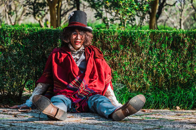 Portrait of smiling man sitting outdoors