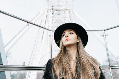 Portrait of beautiful young woman looking away