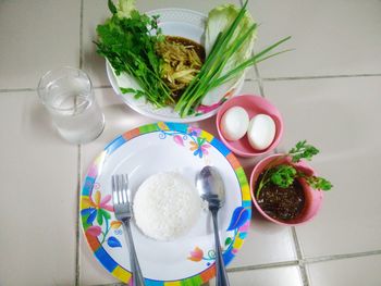 High angle view of vegetables in plate on table