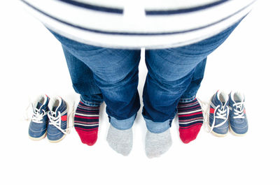 Low section of man wearing canvas shoes