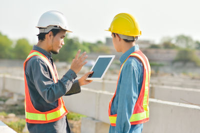 Side view of man working at construction site