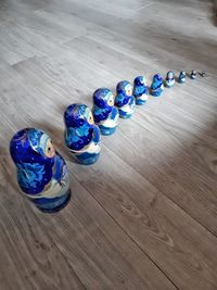 High angle view of multi colored pencils on hardwood floor