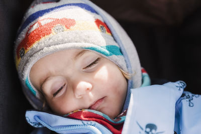 Close-up of girl sleeping at home