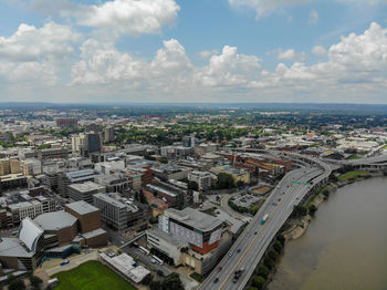 High angle view of buildings and sea against sky