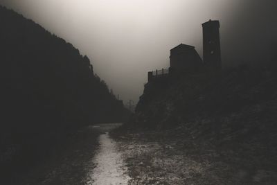 Silhouette of esglesia de sant serni de canillo against sky