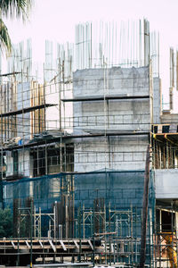 Construction site in city against clear sky