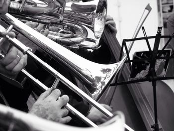 Cropped image of hands playing trumpets