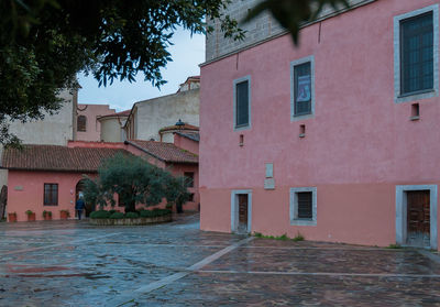 Street amidst buildings against sky