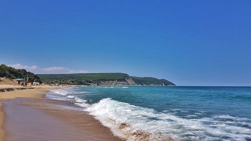 View of beach against blue sky