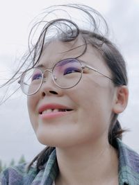 Close-up portrait of a smiling young woman