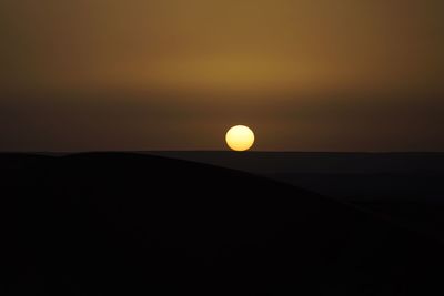 Scenic view of silhouette landscape against sky during sunset