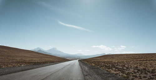 Road amidst landscape against sky