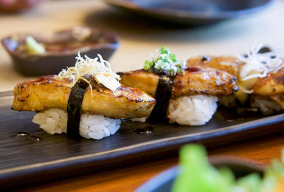 Close-up of sushi served on table