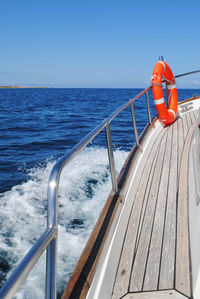 The spray of a fast-moving motor boat. view from board.