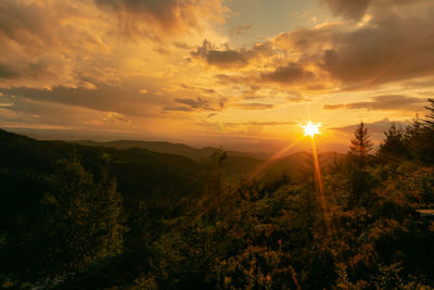 Scenic view of landscape against sky during sunset