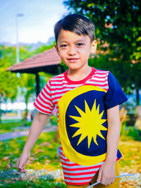 Portrait of boy standing outdoors