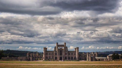 Old building against cloudy sky