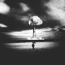 Silhouette of woman in water against cloudy sky