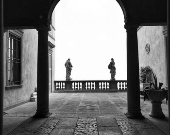 People standing in corridor of building