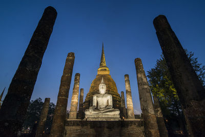 Low angle view of statue of building against sky