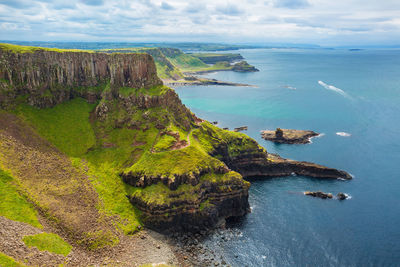 High angle view of rocks on sea against sky