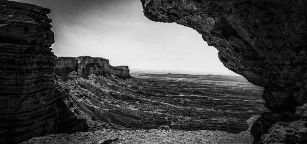 Rock formations in sea against sky