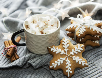 Christmas decorations, cocoa and gingerbread cookies. white wooden background.