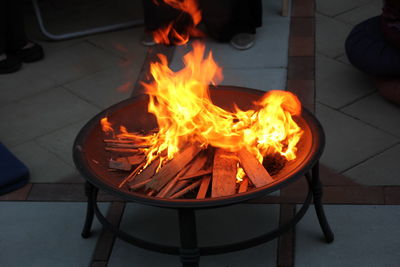 Feet around a fire pit 