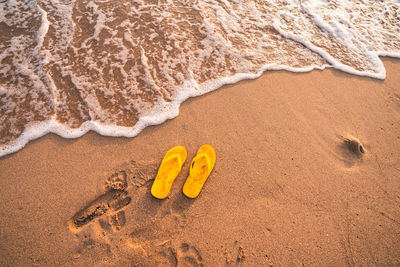 High angle view of text on sand at beach