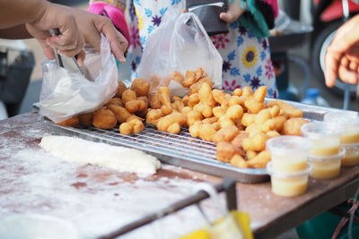 High angle view of people preparing food at street market