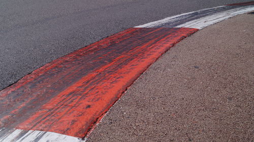 Close-up of red road marking