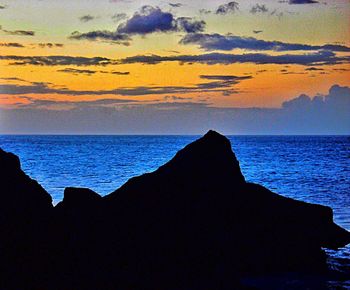 Scenic view of sea at sunset