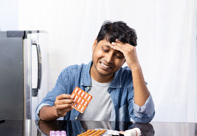 Side view of man preparing food at home