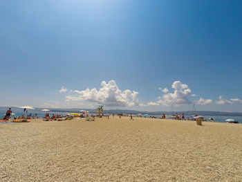 Panoramic view of beach against blue sky