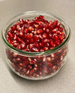 High angle view of pomegranate seeds in glass bowl