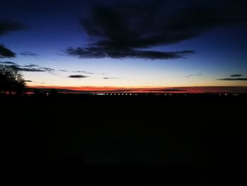 Scenic view of silhouette landscape against sky at sunset