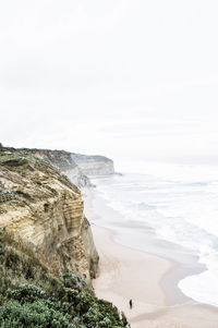 Scenic view of cliffs by the sea