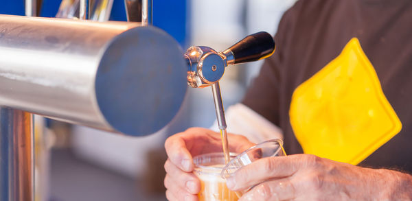 Close-up of hand holding drink