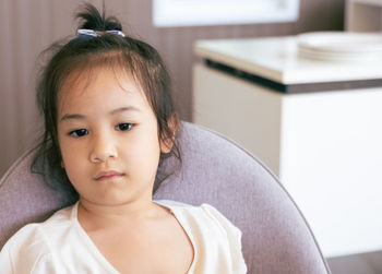 Portrait of cute girl at home