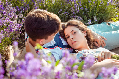 Loved people in a lavender field, a man and a woman love each other