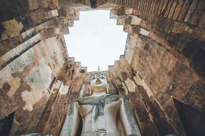 Low angle view of statue against sky