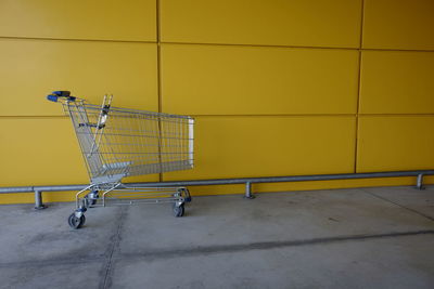 Shopping cart by wall